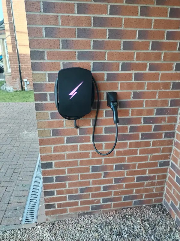 Wall-mounted charger, tidy corner run